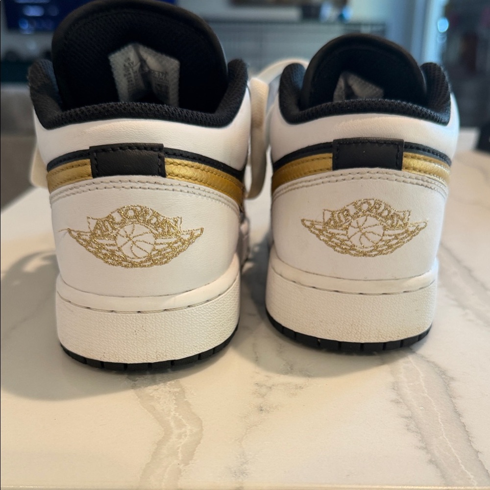 Jordan Black and Gold Sneakers